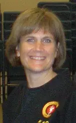 Kristen Schmid smiling in her karate uniform