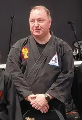 Sensei Robbie Gorringe in his black karate uniform